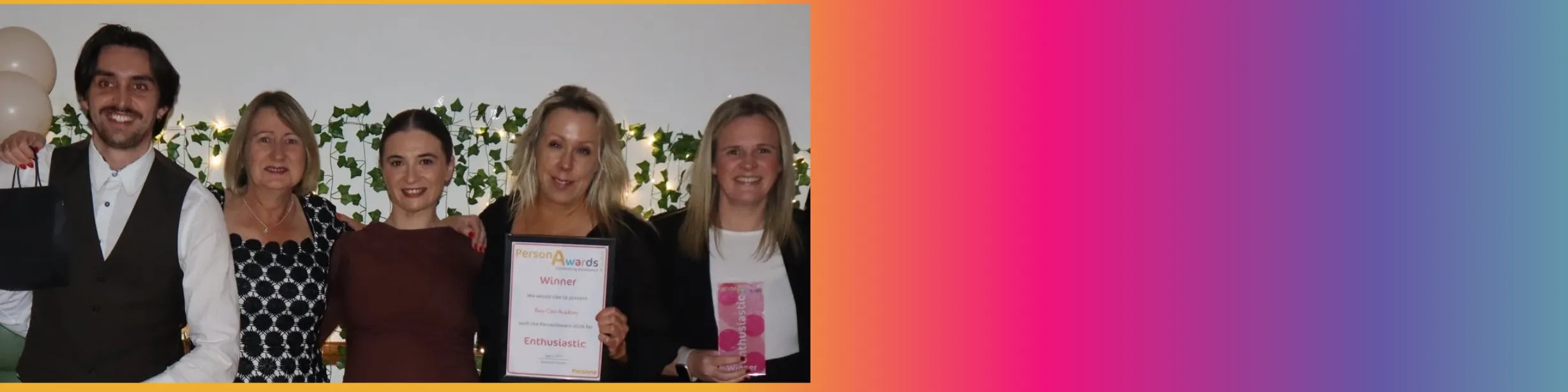 Bury Care Academy team photographed, manager is seen holding flowers