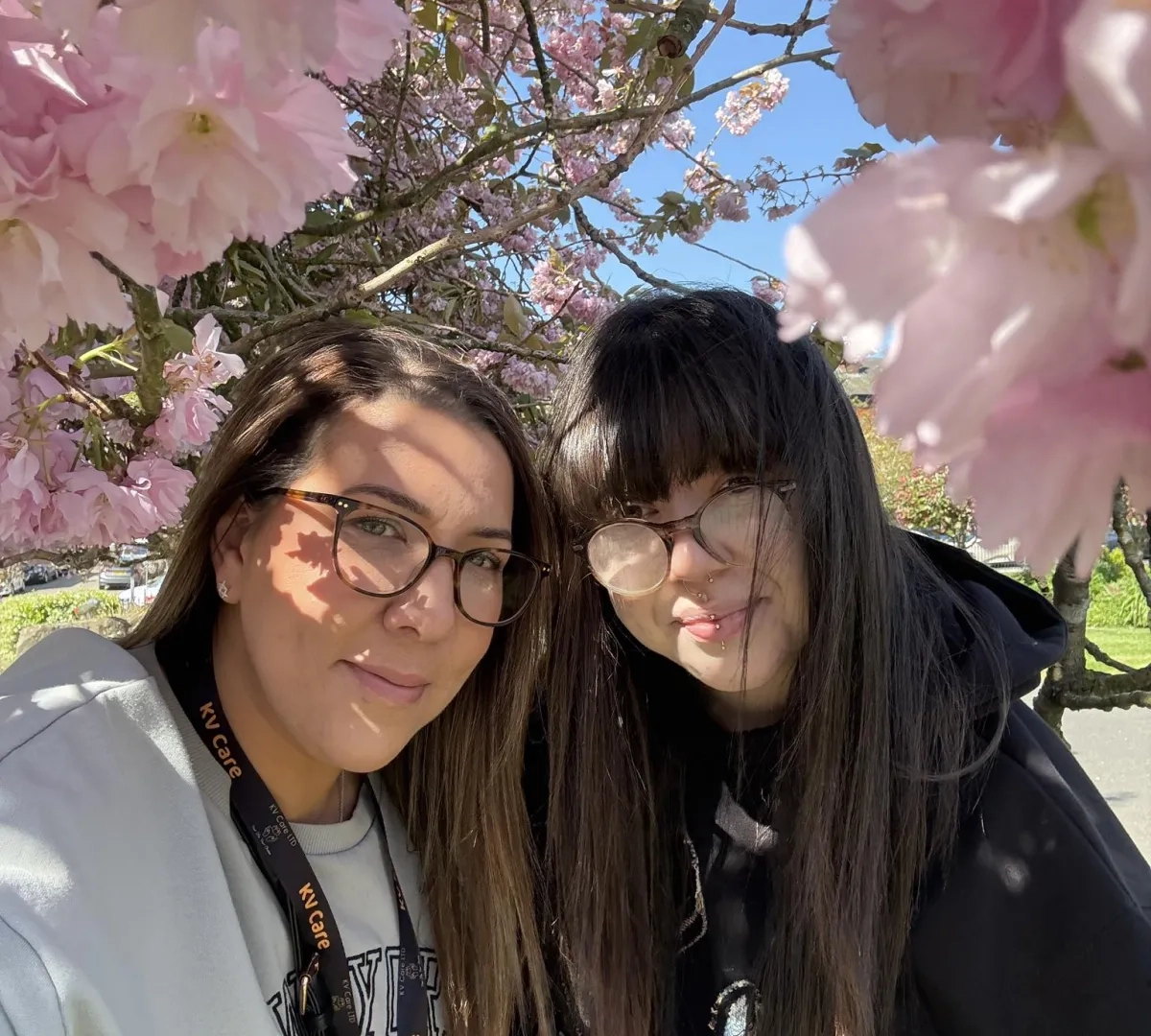 domicilary care worker posing for a photo with someone who they support