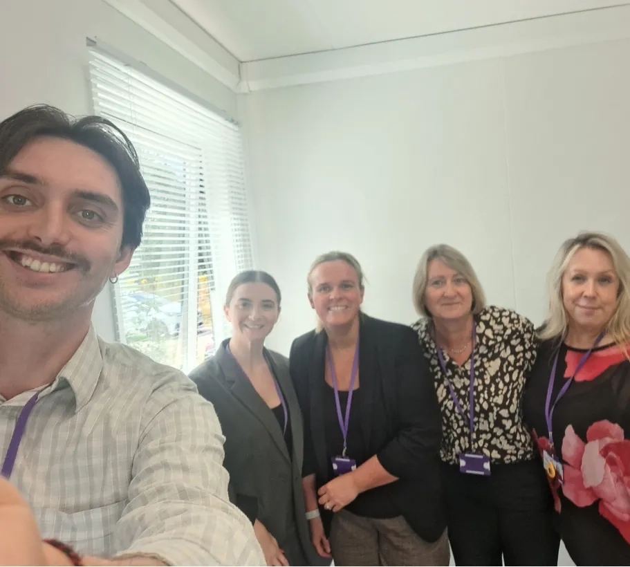 Bury Care Academy team posed in office for team selfie