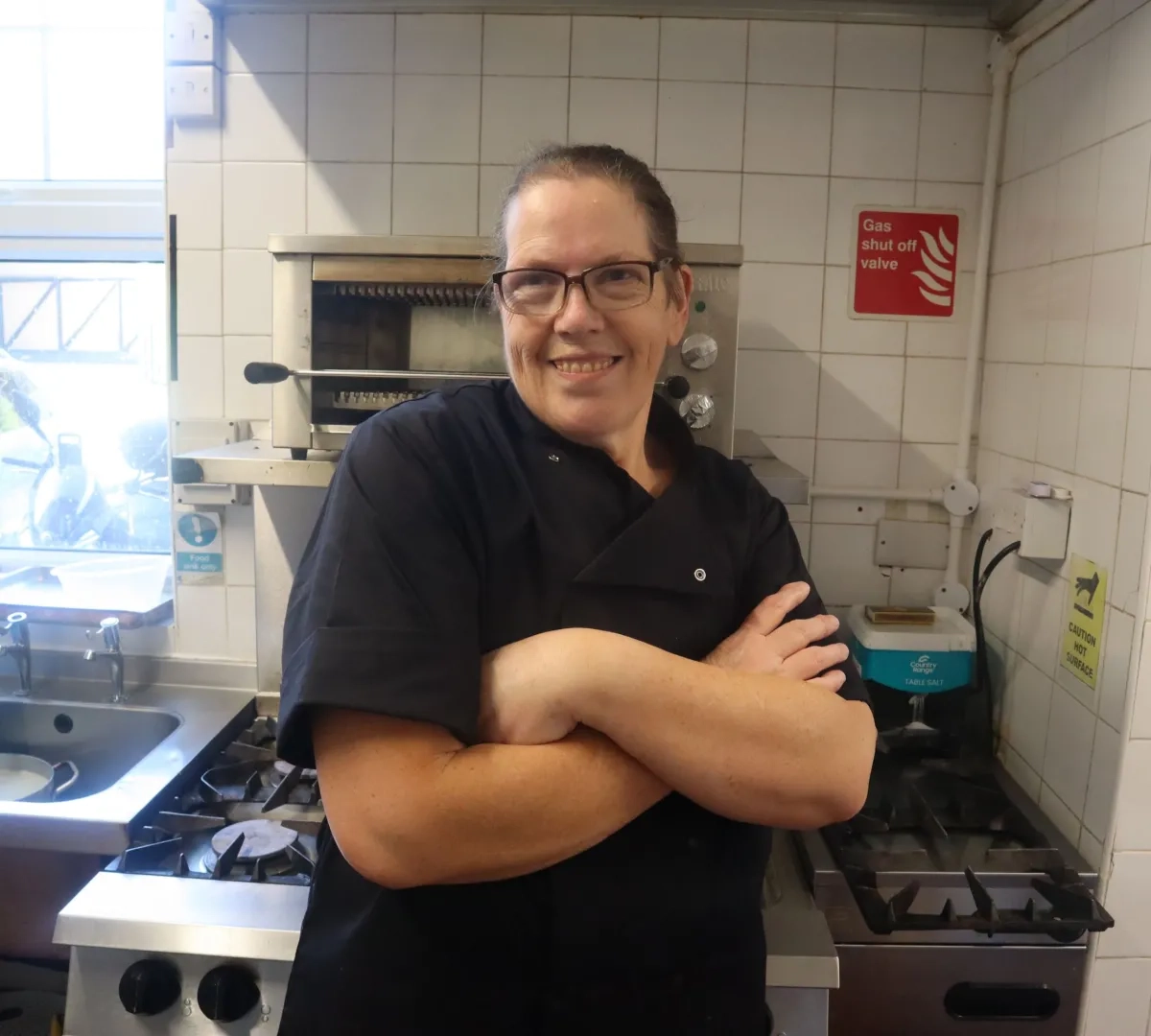 Care home kitchen assistant in a residential care home kitchen.