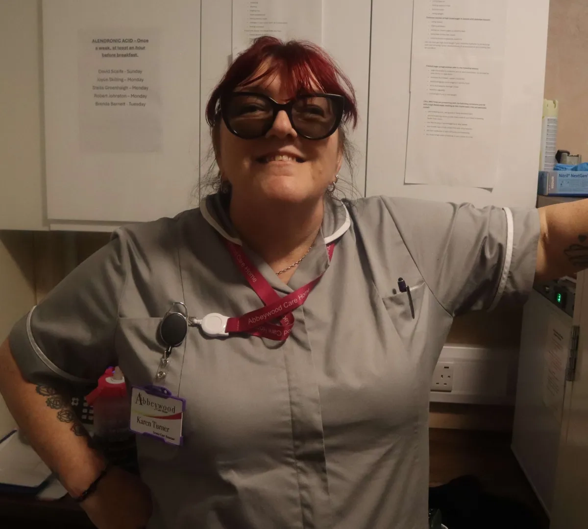 Night Care Assistant in Bury photographed smiling in office.